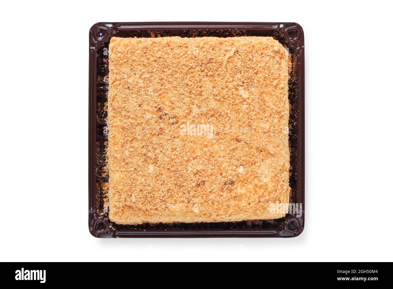 Torta quadrata su un supporto di plastica. Vista dall'alto Foto Stock