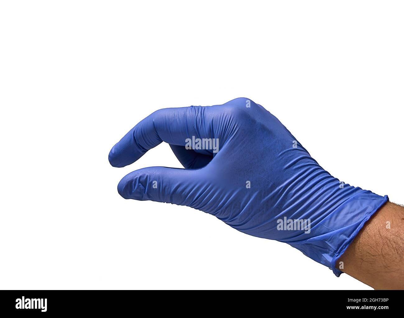 Un medico con un guanto blu, con le dita con un gesto che indica un problema piccolo, minimo, minuscolo o poco importante. Foto Stock