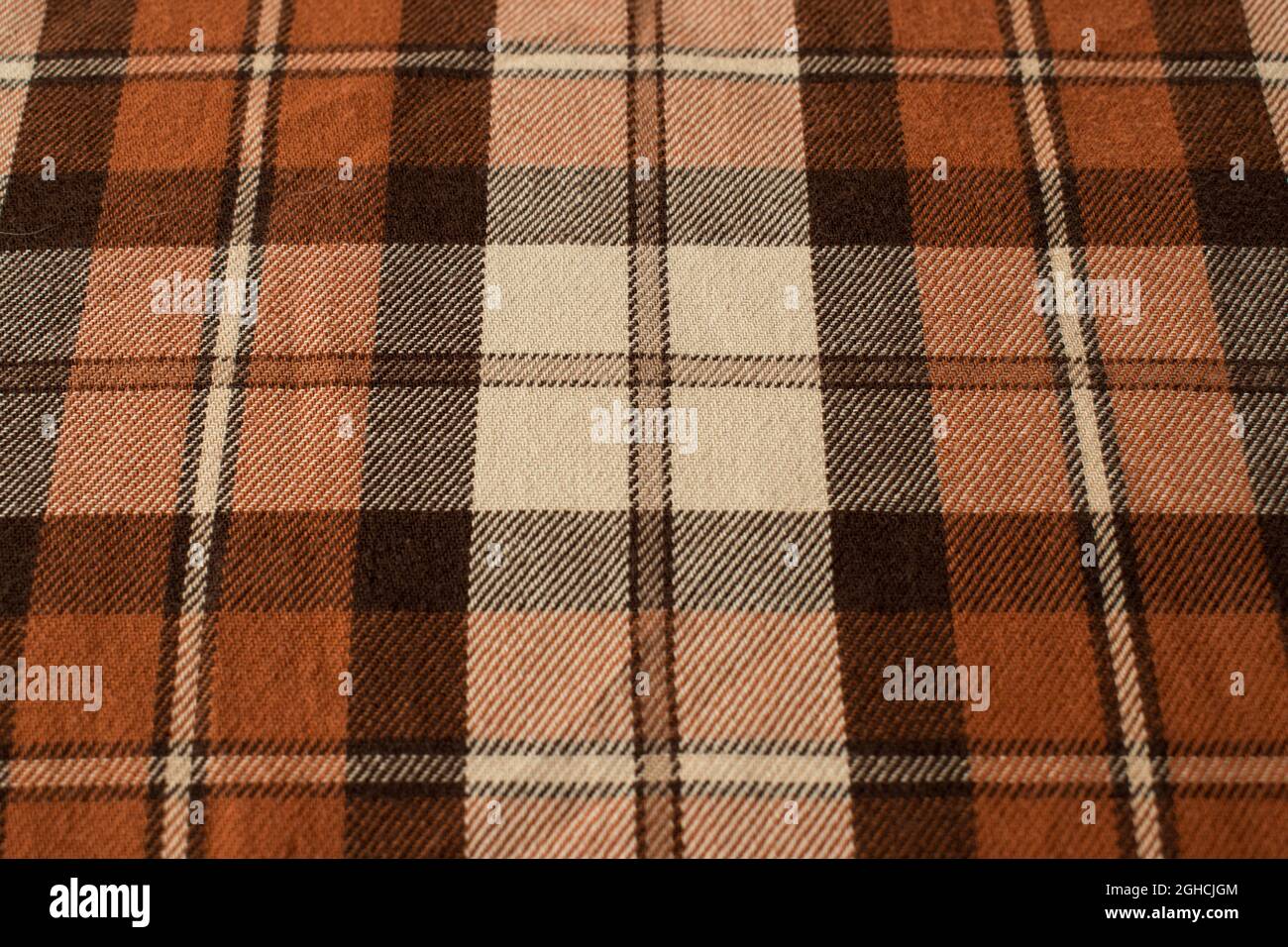 Primo piano dello sfondo marrone della camicia a quadri Foto Stock