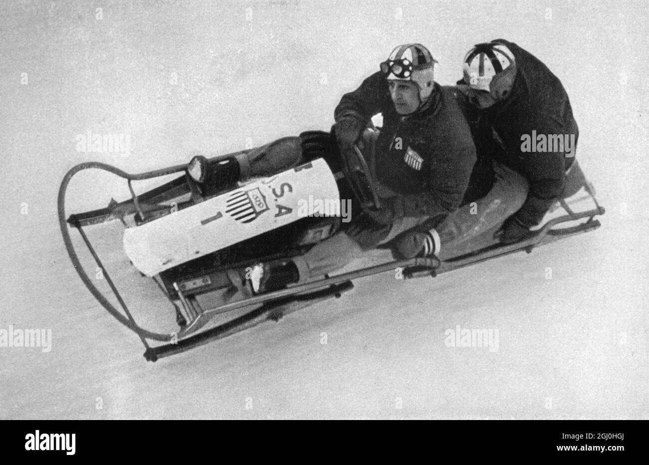 1936 Giochi Olimpici invernali Garmisch - Partenkirchen, Germania USA i - 2 uomini bob team di Alan M. Washbond e Ivan Elmore Brown in azione. Hanno vinto la medaglia d'oro. ©TopFoto Foto Stock