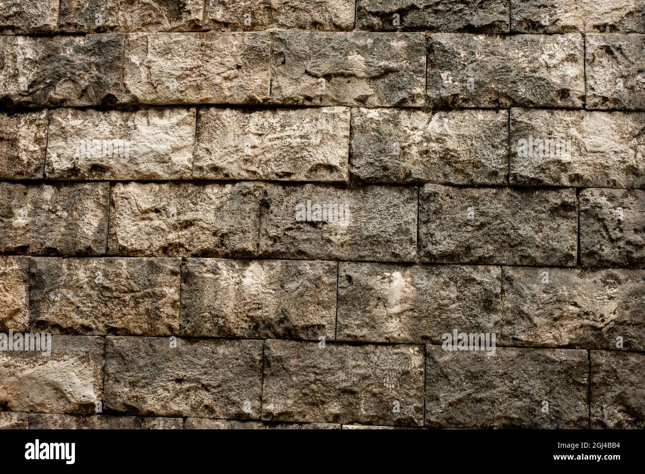 Mattoni senza giunture parete di pietra elevazione per sfondi Foto Stock