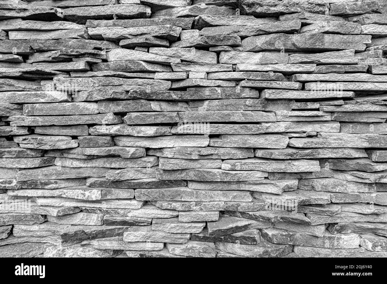 Muro lastricato di pietra come sfondo. Foto Stock
