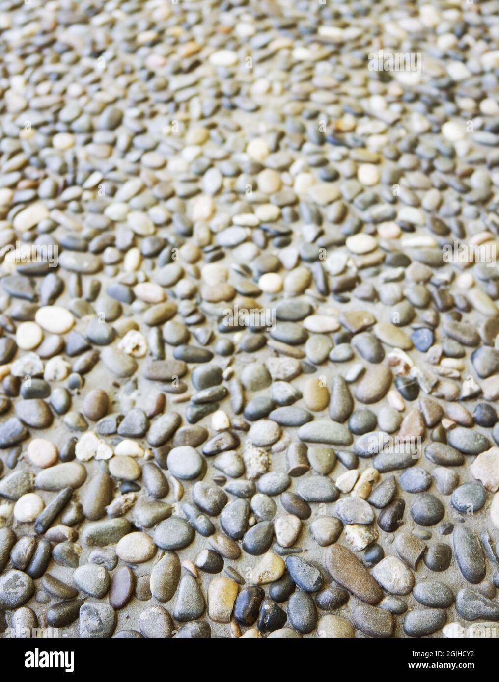 Strada in pietra acciottolata naturale. Sfondo bellissimo. Foto Stock