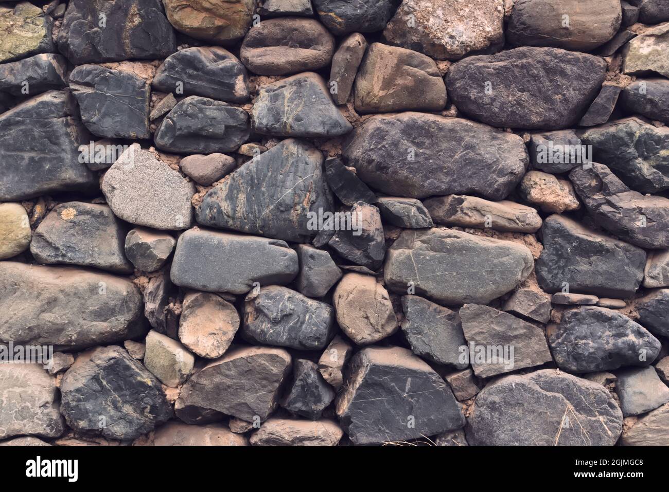 Muro di pietra naturale. Trama full frame. Foto Stock
