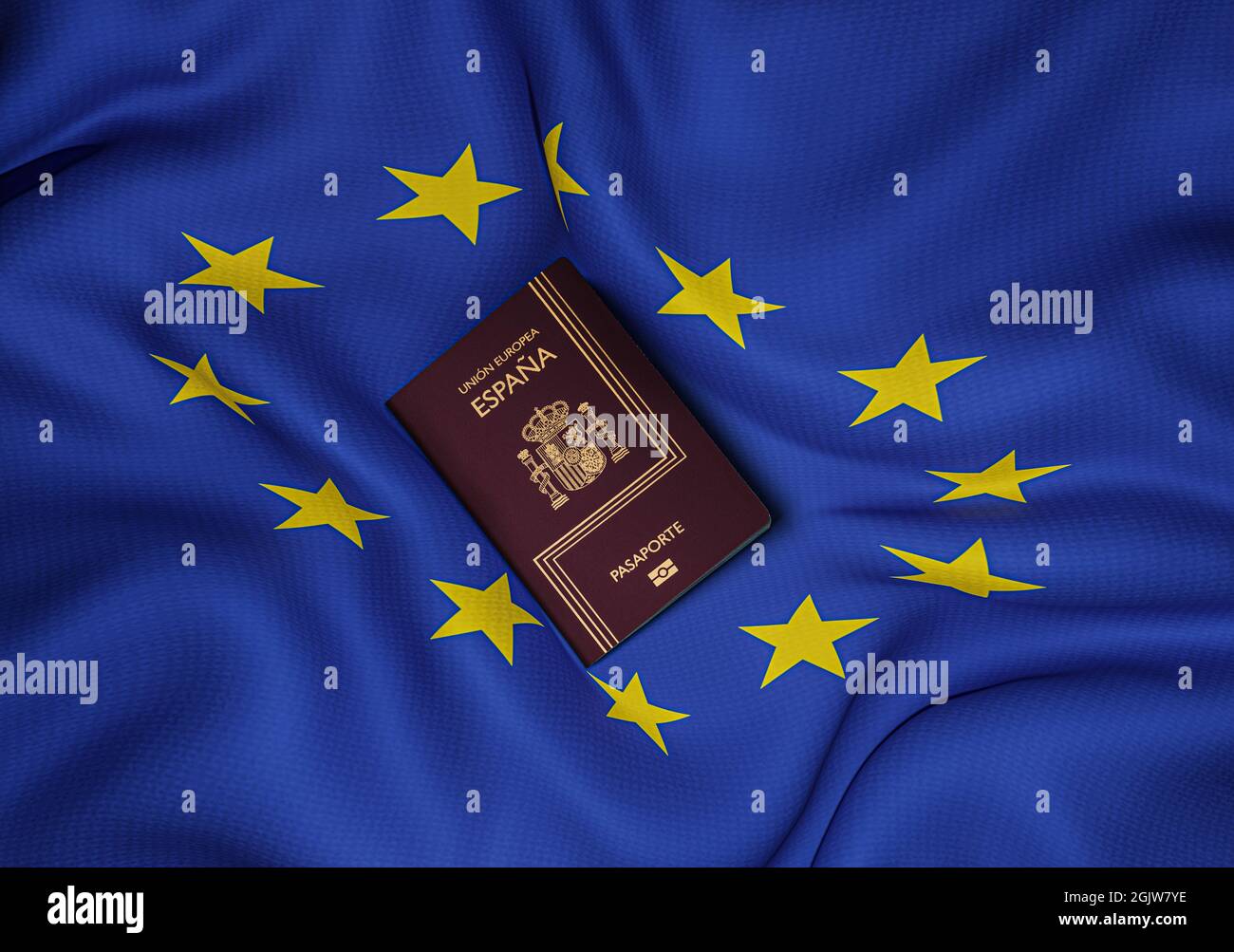 Passaporto spagnolo con bandiera dell'Unione europea al centro della foto, vista dall'alto Foto Stock