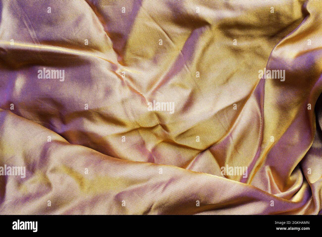 Texture sfondo foto di tessuto sintetico di seta arancione. Foto Stock