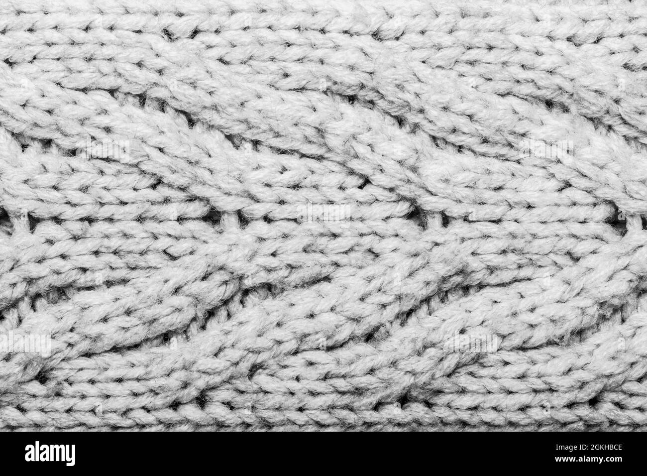 Texture sfondo foto di colore grigio cavo tessuto tessuto lavorato a maglia. Foto Stock