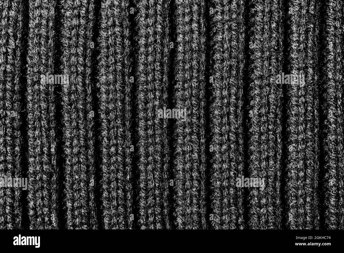 Texture sfondo foto di colore grigio doppia maglia superficie tessuto. Foto Stock