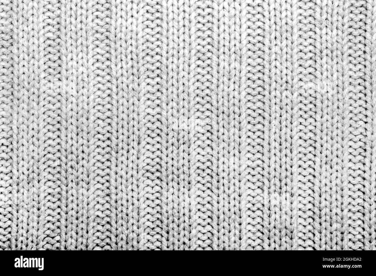 Texture sfondo foto di tessuto a maglia grigio. Foto Stock