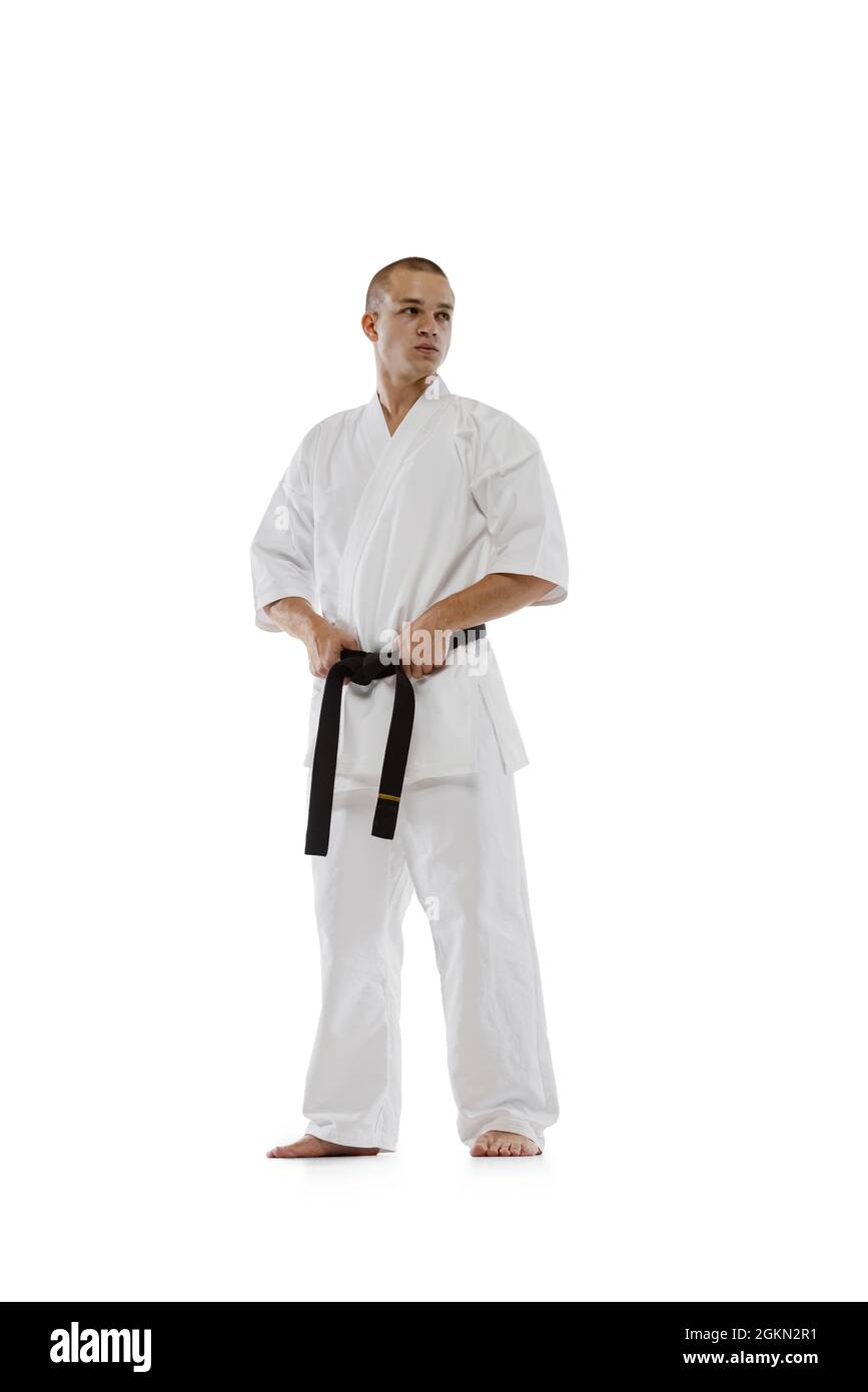 Ritratto completo di kimono professionale con cintura nera isolata su  sfondo bianco. Karate, judo, taekwondo sport Foto stock - Alamy