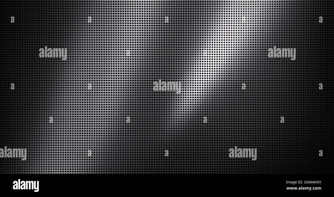 Piastra metallica forata con luce spot. Primo piano su sfondo metallico Foto Stock