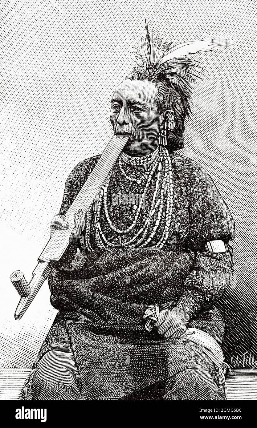 American Indian Redskin uomo nativo fumare una pipe al Jardin d'Acclimatation a Parigi, Francia. Europa. Antica illustrazione del 19 ° secolo inciso da la Nature 1883 Foto Stock