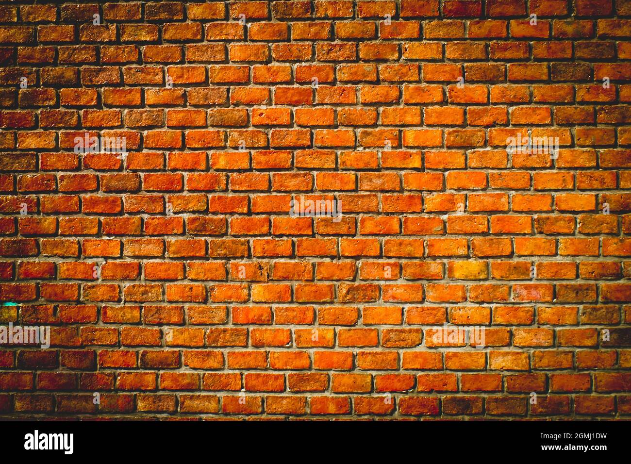 sfondo muro di mattoni arancioni. sfondo muro grunge arancione Foto Stock