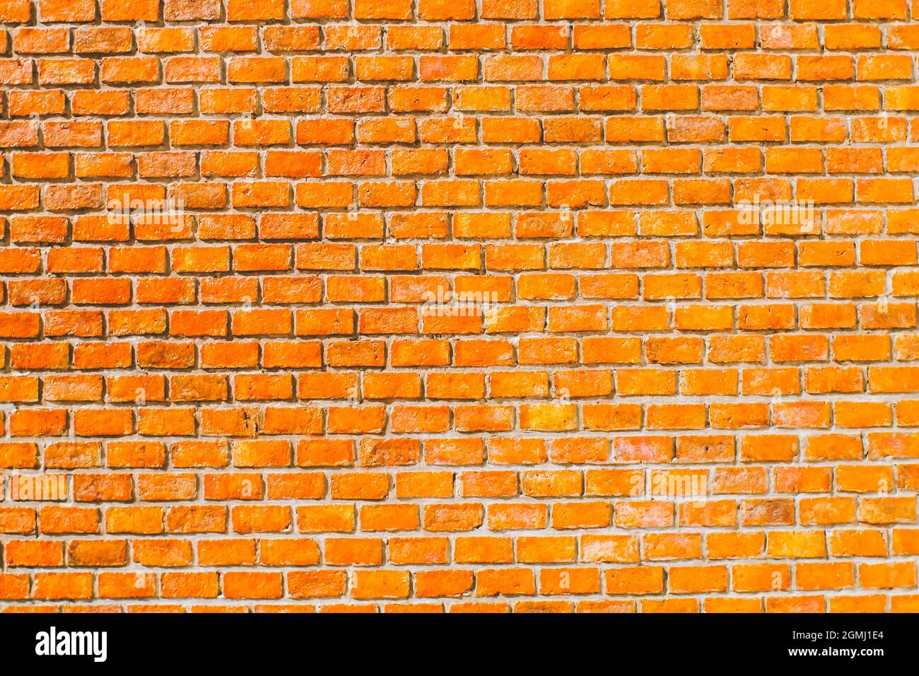 sfondo muro di mattoni arancioni. sfondo muro grunge arancione Foto Stock