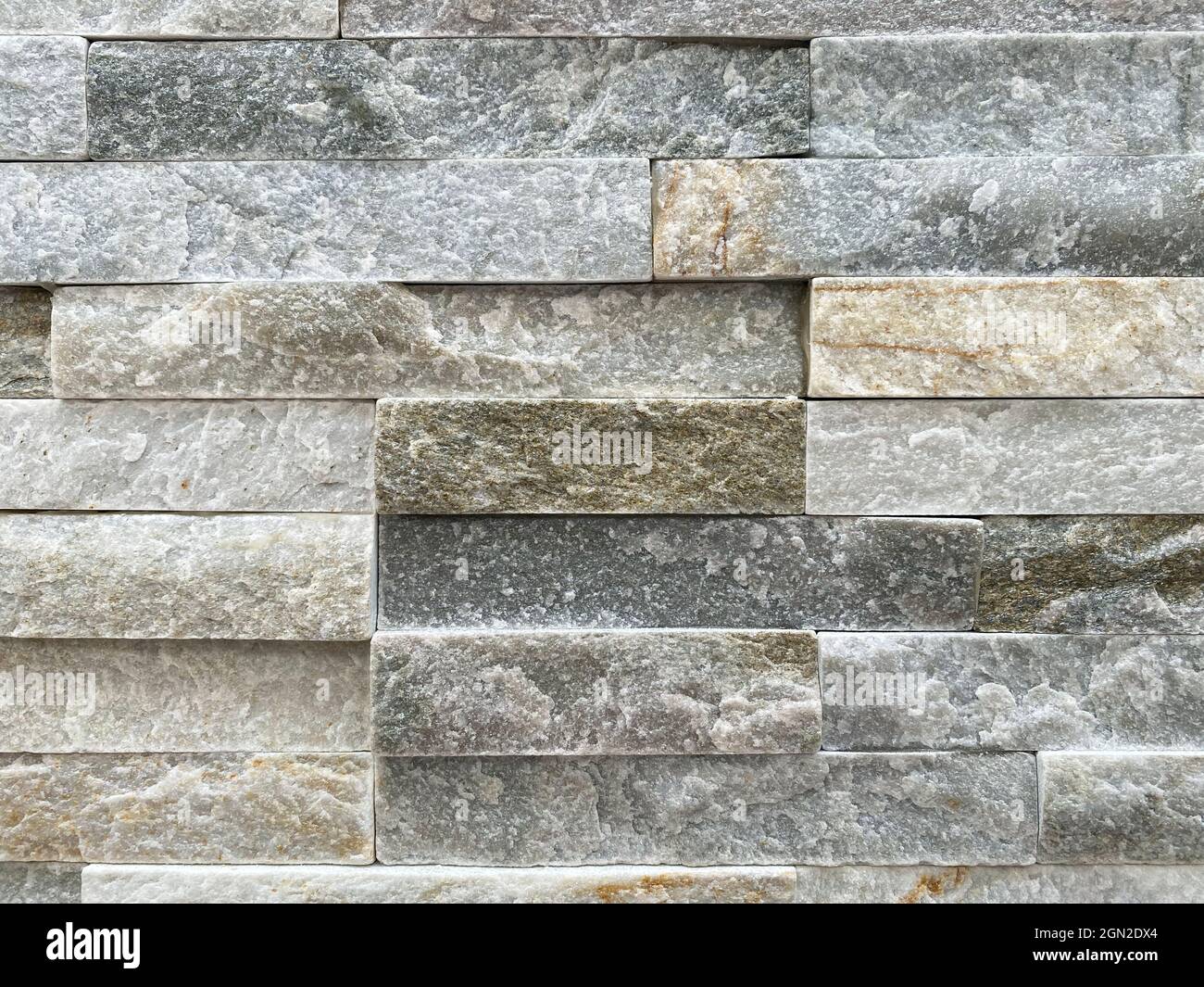 Sfondo della parete in marmo. Muro di mattoni di marmo come texture e sfondo. Foto Stock