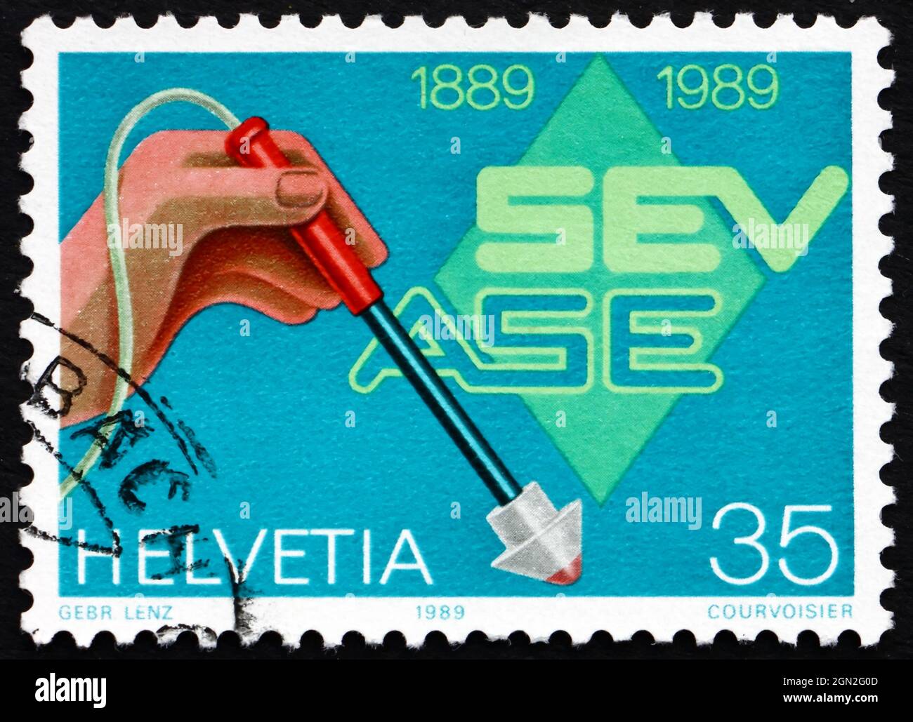 SVIZZERA - CIRCA 1989: Un francobollo stampato in Svizzera mostra l'Associazione svizzera degli elettricisti, Centenario, circa 1989 Foto Stock