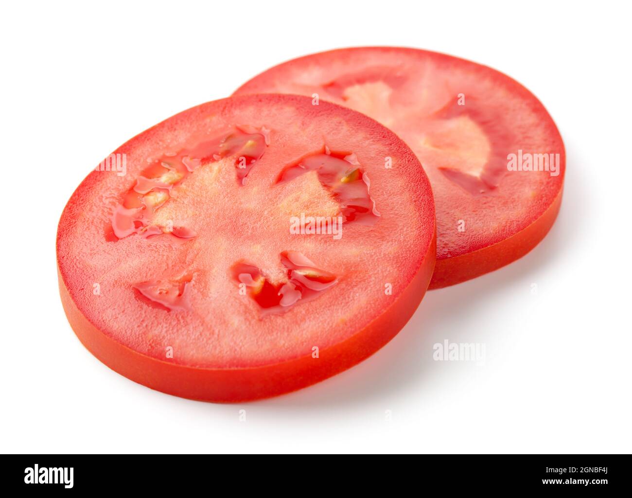 Due fette di pomodoro isolate su sfondo bianco Foto Stock