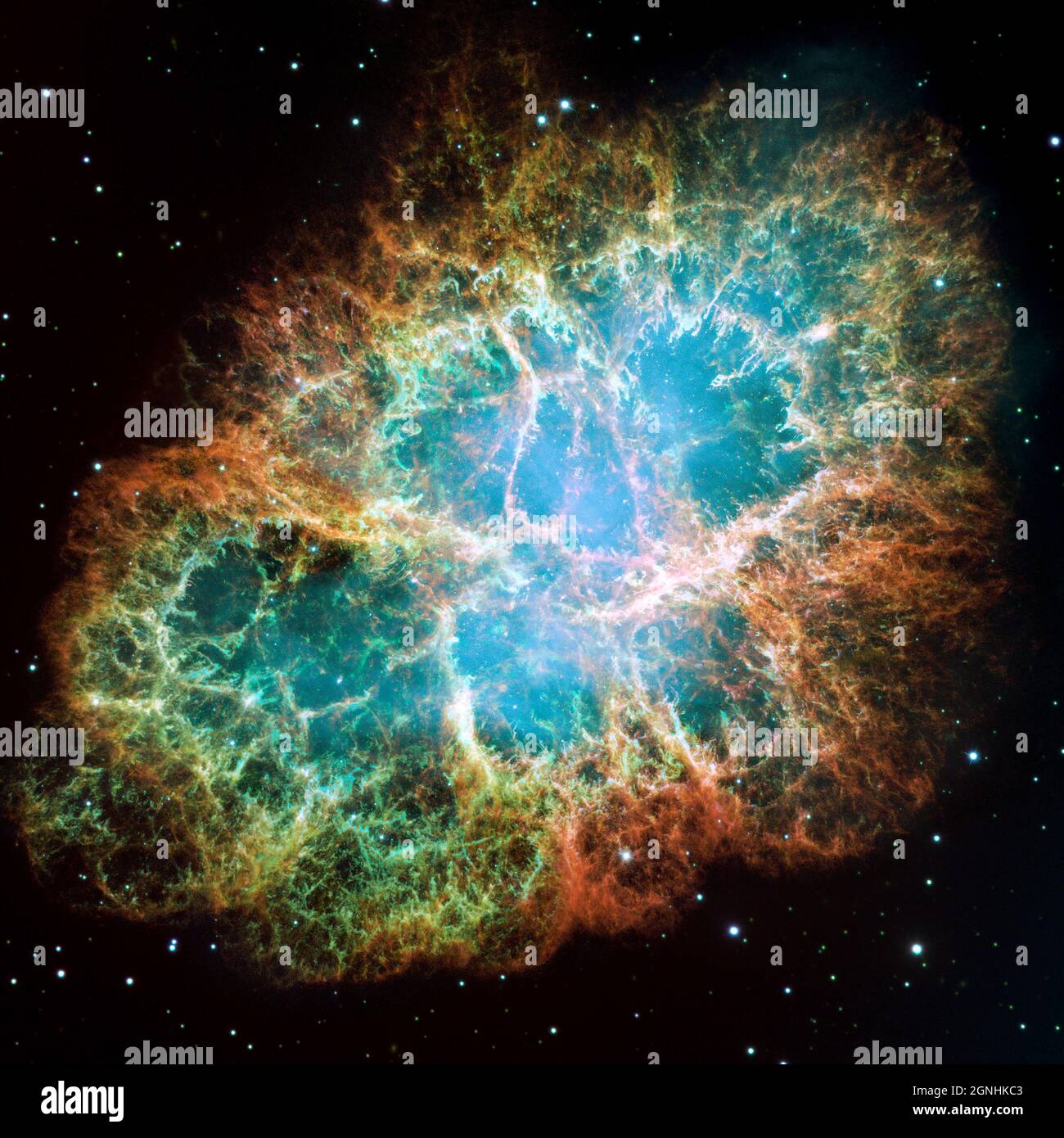 Il Granchio Nebula, un residuo di supernova in espansione di sei anni luce. JBlue nei filamenti nella parte esterna della nebulosa rappresenta ossigeno neutro, verde è zolfo ionizzato singolarmente, e rosso indica ossigeno doppiamente ionizzato. . Fonte immagine NASA/ESA Hubble Space Telescope Foto Stock