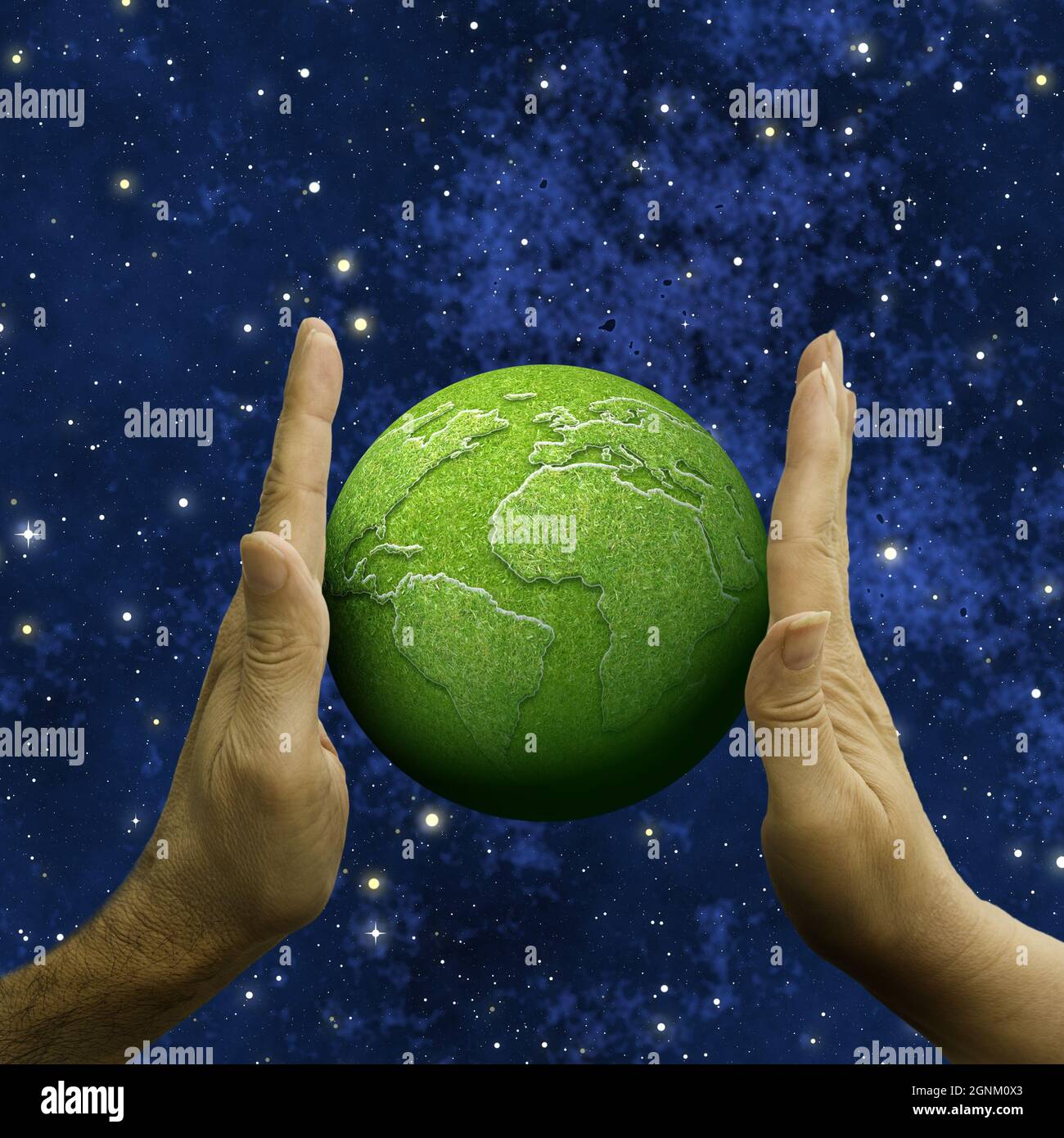 Mano maschio e femmina che tiene un pianeta Terra verde Foto Stock