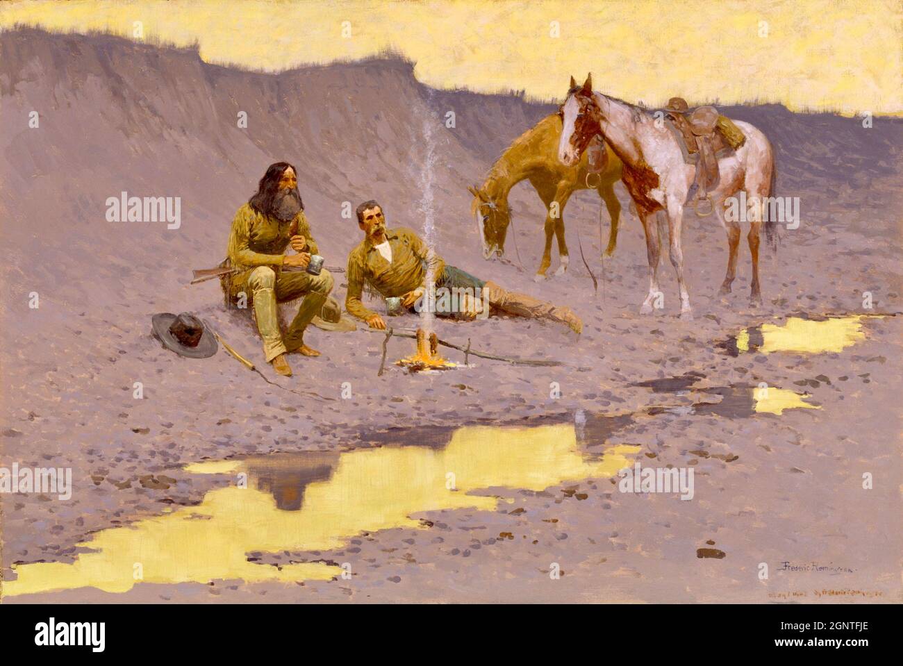 L'opera di Frederick Remington - un anno nuovo sul Cimarron - due cowboy e i loro cavalli si riposano intorno al fuoco. Foto Stock