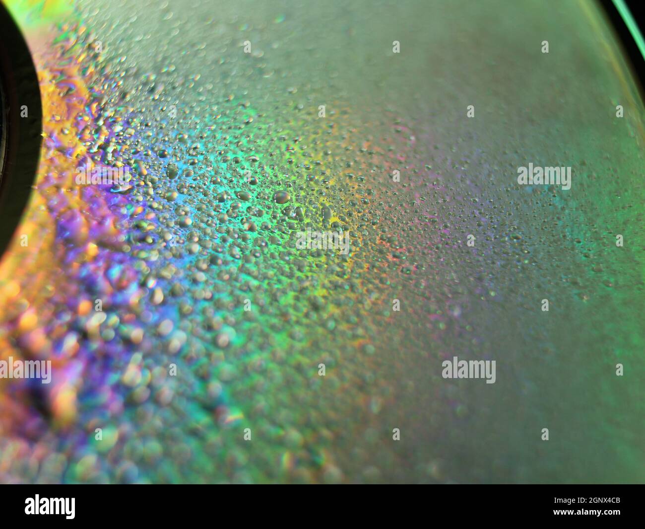 Colori astratti Rainbow drops riflessi macro sfondo sfocato Foto Stock