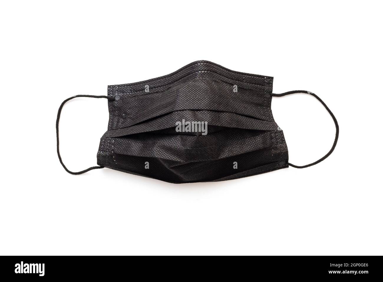 Maschera protettiva nera isolata su bianco. Maschera nera per un abbigliamento forte. Foto Stock