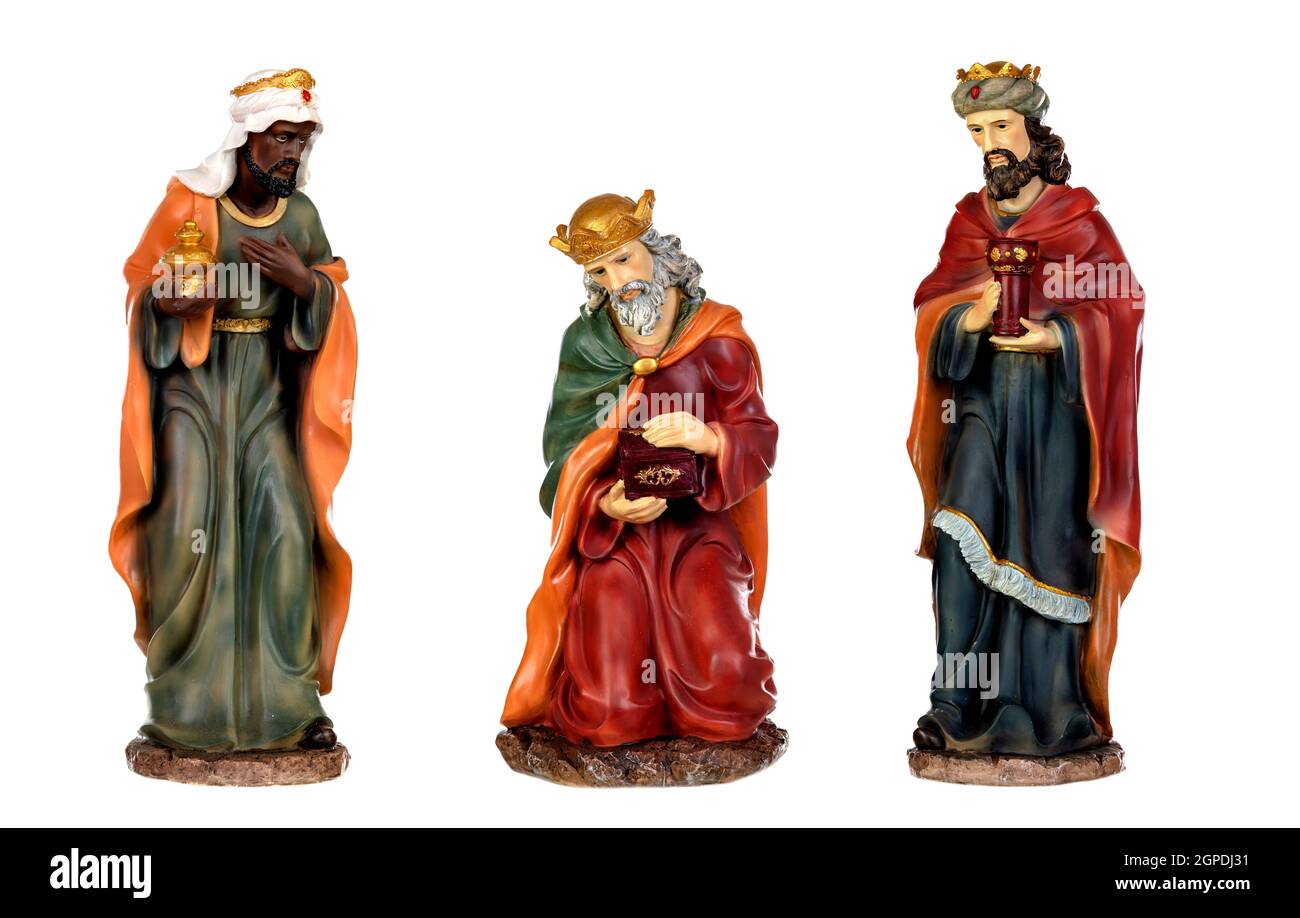I tre re magi e Gesù Bambino. Le figure in ceramica isolata su sfondo bianco Foto Stock