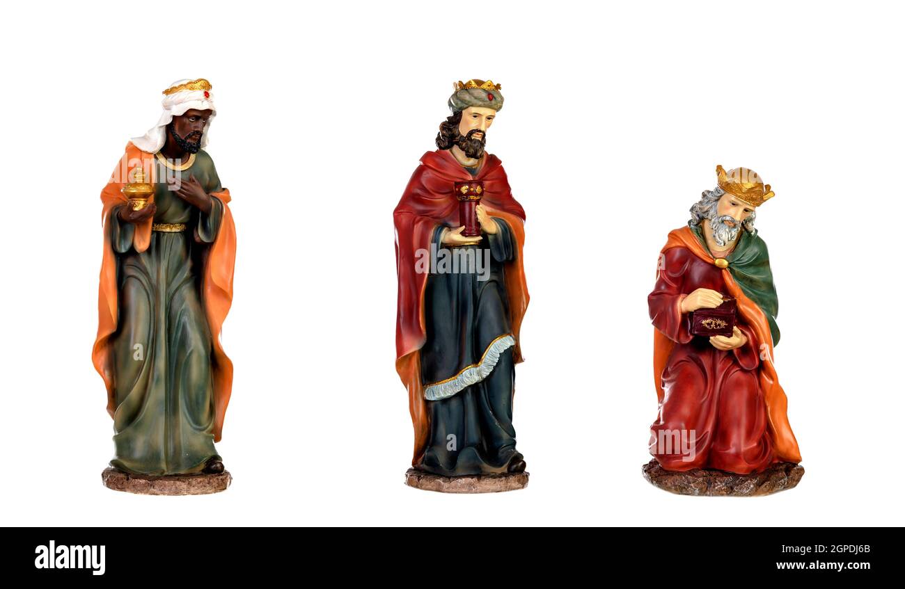 I tre re magi e Gesù Bambino. Le figure in ceramica isolata su sfondo bianco Foto Stock