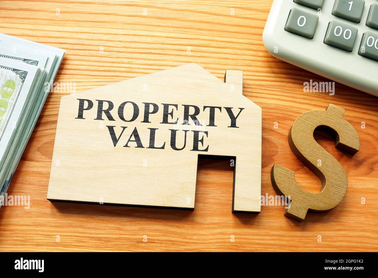 Frase di valore di proprietà sul modello di casa. Foto Stock