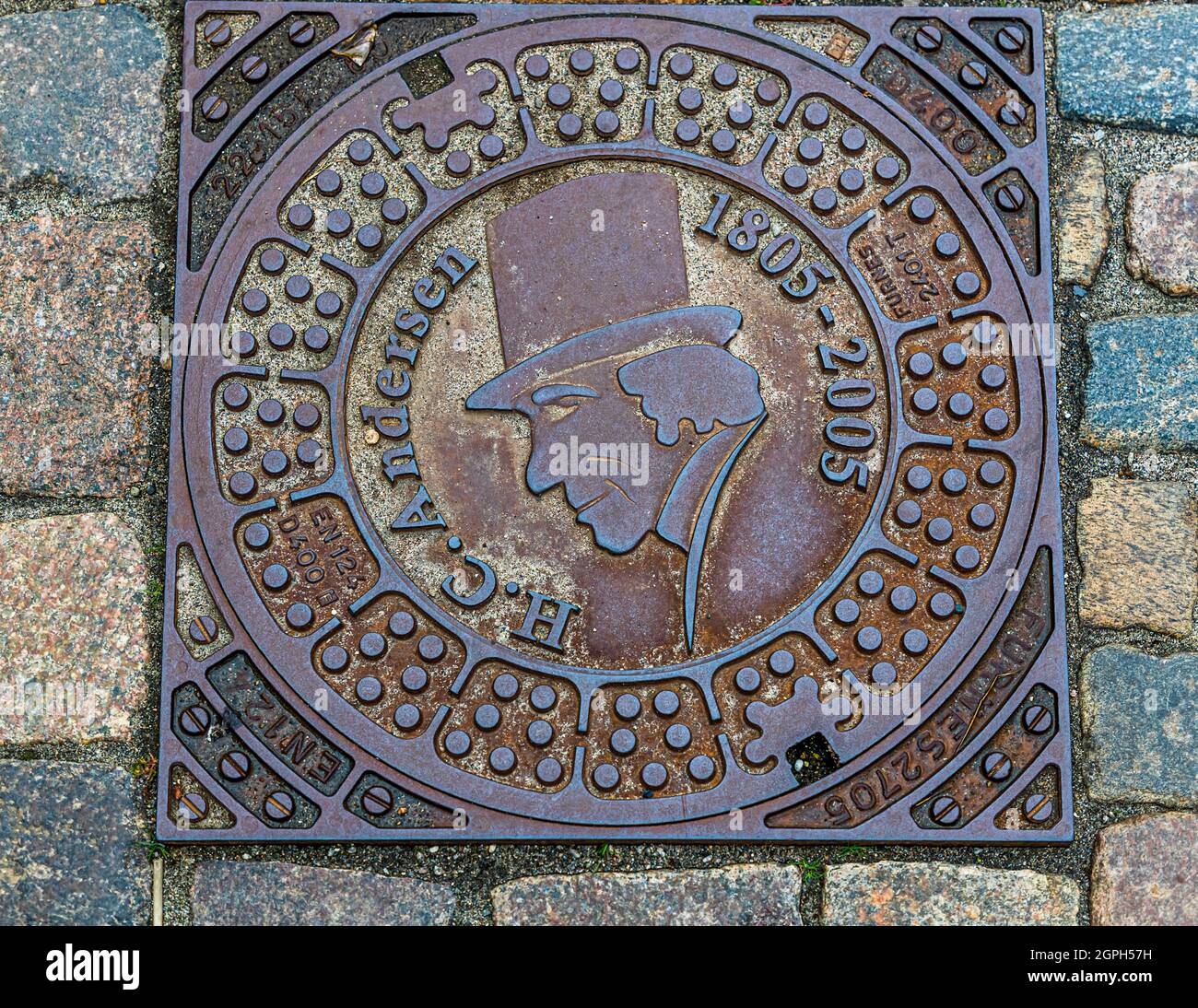 Hans Christian Andersen manhole cover a Odense, Danimarca Foto Stock