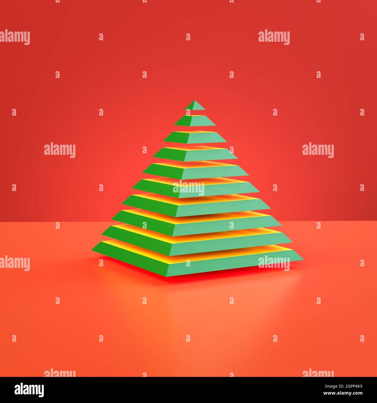 Albero di natale astratto. Una piramide verde tagliata a pezzi che si sovrappone a uno sfondo rosso. Foto Stock
