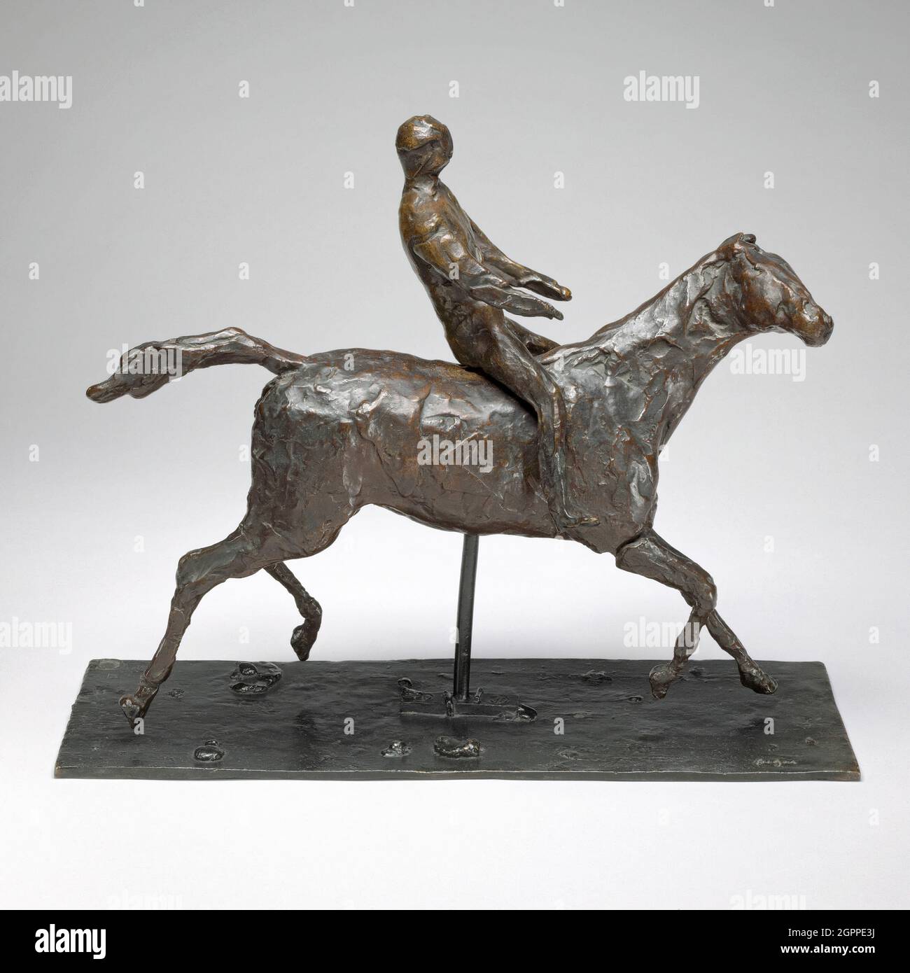 Cavallo con Jockey; Horse Galloping, girando la testa a destra, i piedi non toccano il terreno, modellato a metà del 1870 (cast prima del 1951). Foto Stock