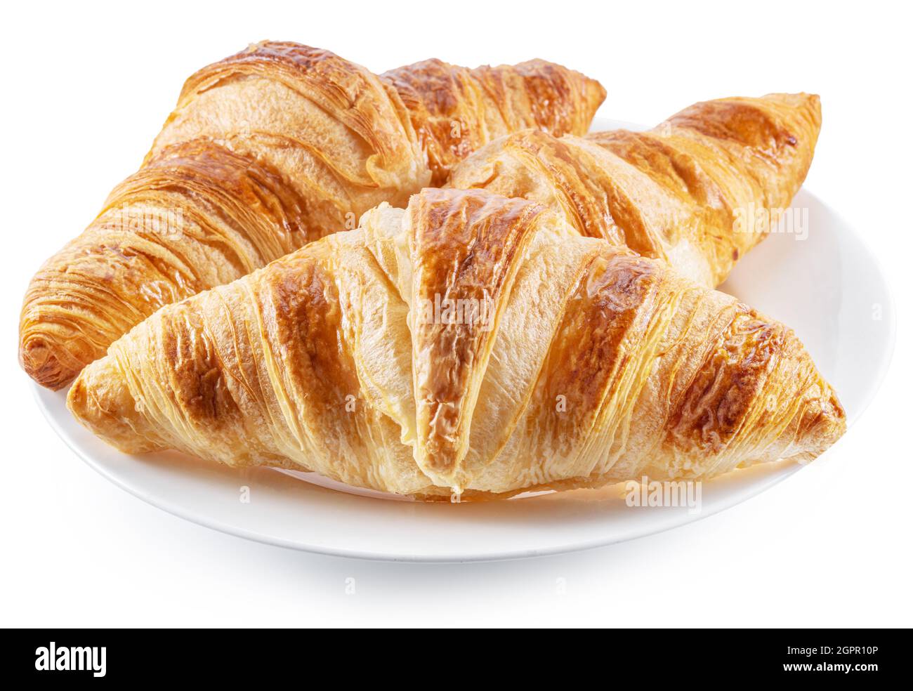 Gustosi croissant croccanti sul piatto su sfondo bianco. Foto Stock