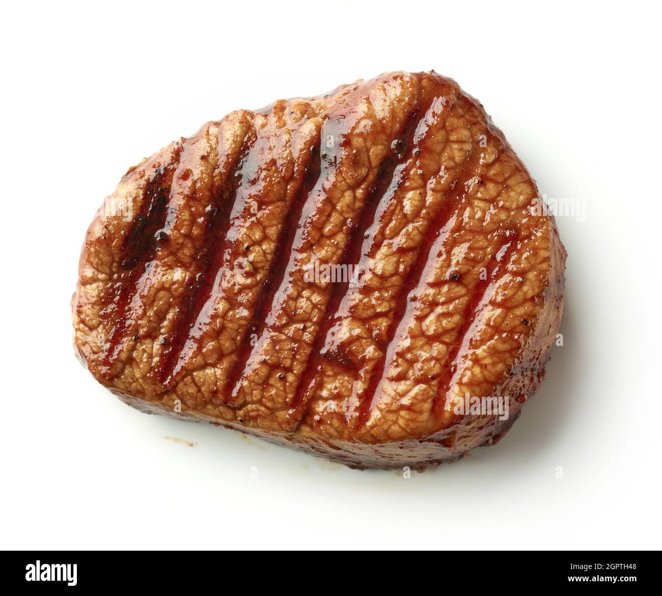 Bistecca di filetto di manzo alla griglia isolata su sfondo bianco, vista dall'alto Foto Stock