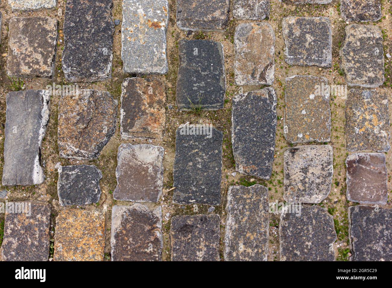 Una strada di mattoni. Vecchio blocco di passaggio pavimento Foto Stock