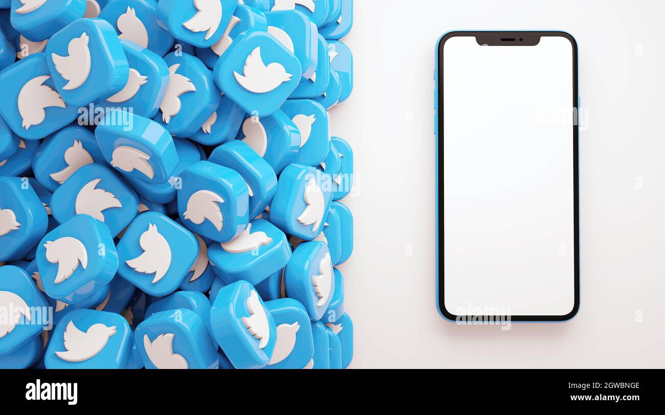 Valencia, Spagna - Ottobre, 2021: Un mucchio di icone delle app Twitter con il cellulare mockup schermo vuoto in 3D rendering. Twitter è un netwo gratuito per i social media Foto Stock