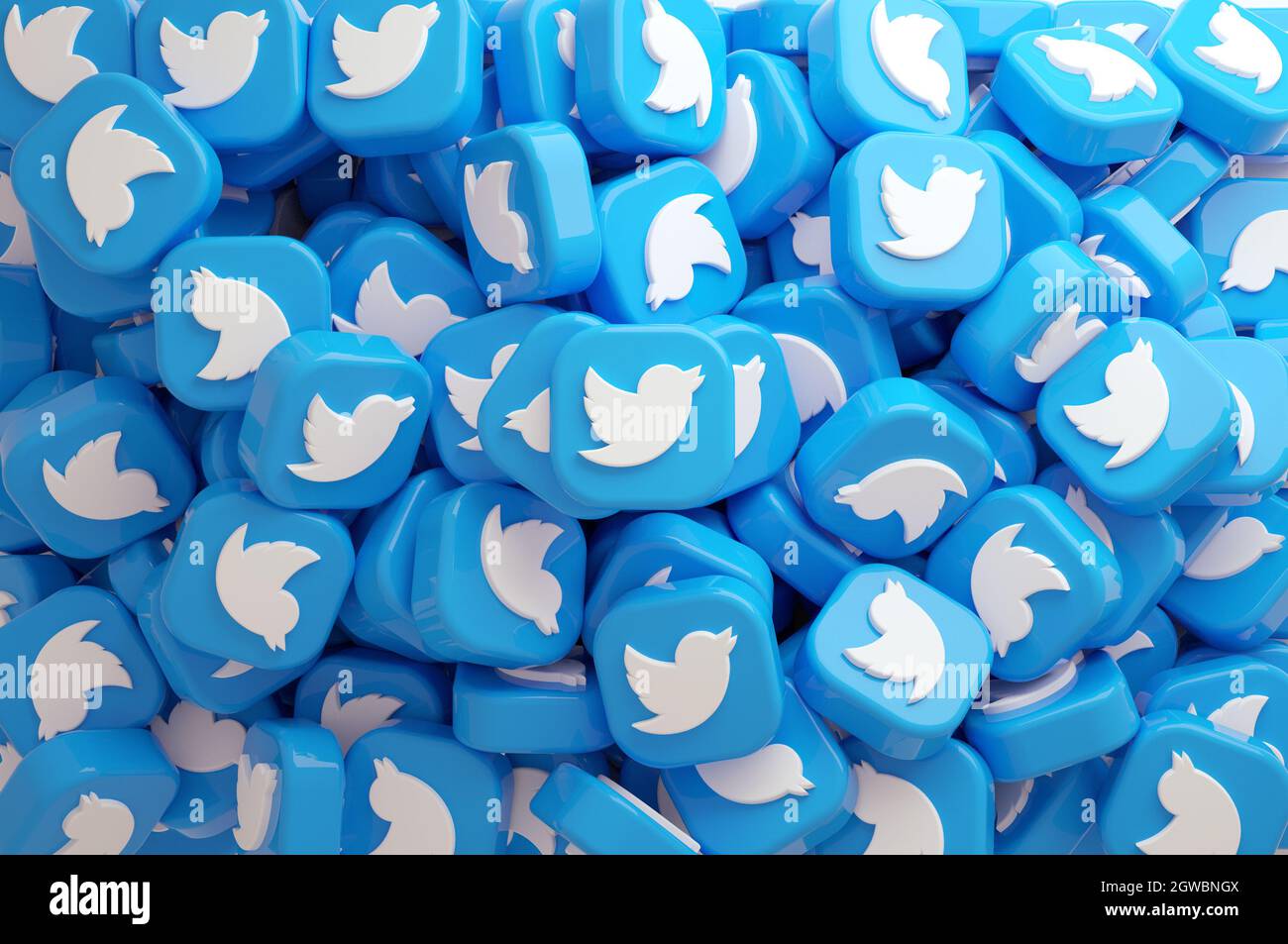 Valencia, Spagna - Ottobre, 2021: Vista dall'alto di un grosso mucchio di icone Twitter con il mockup schermo bianco del telefono in 3D rendering. App di social media network Foto Stock