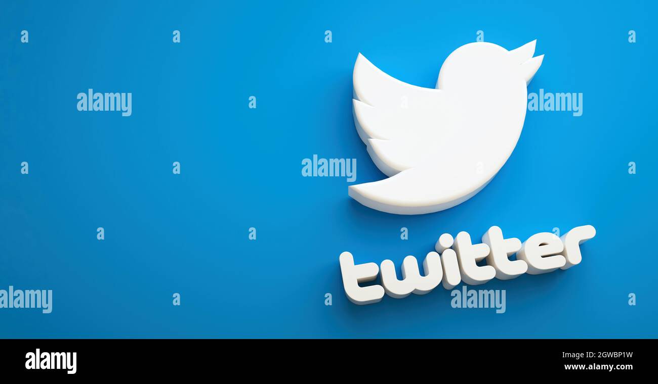 Valencia, Spagna - Ottobre, 2021: Icona isolata di uccello logo Twitter per smartphone su sfondo blu spazio di copia in 3D rendering. Rete di social media gratuita Foto Stock