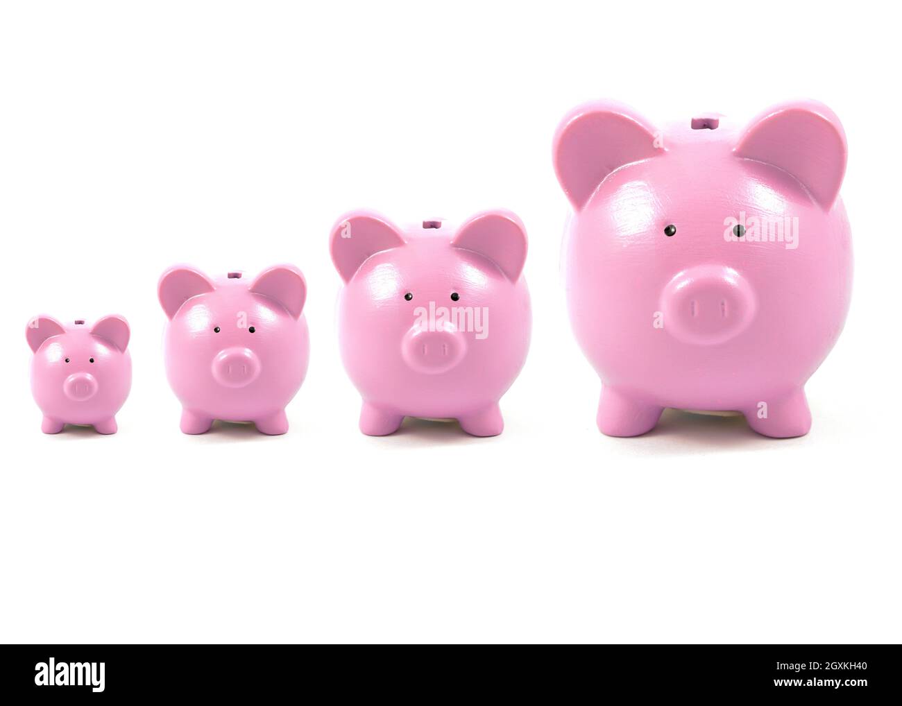 Un'immagine concettuale delle banche di piccini rosa che crescono nel tempo per illustrare la crescita del risparmio. Foto Stock