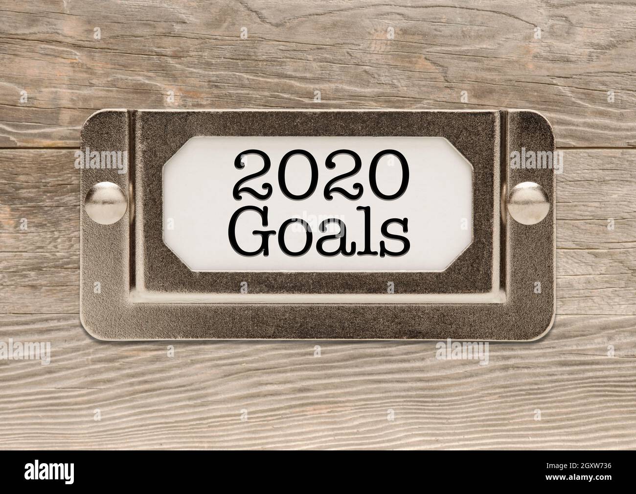 Gli obiettivi 2020 metallo Cabinet File etichetta sul telaio di legno. Foto Stock