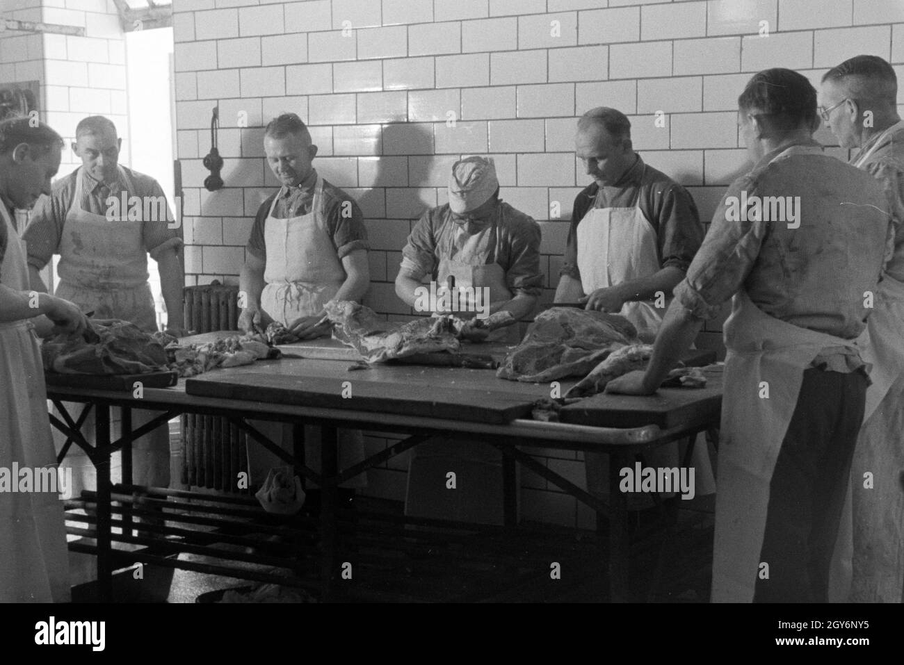 Angestellte des Musterbetriebs Wilhelm prugna in München Gladbach, Deutsches Reich 1941. I dipendenti della pianta modello Wilhelm prugna in München Gladbach, Germania 1941. Foto Stock