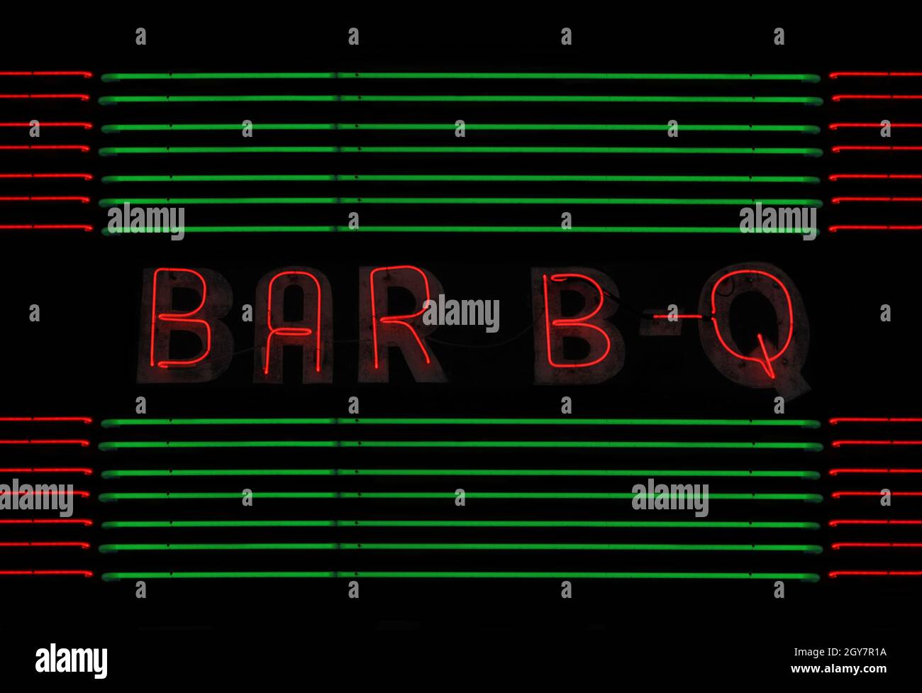 Cartello al neon barbecue con Green e Red Neon Tubes Ristorante locale Foto Stock