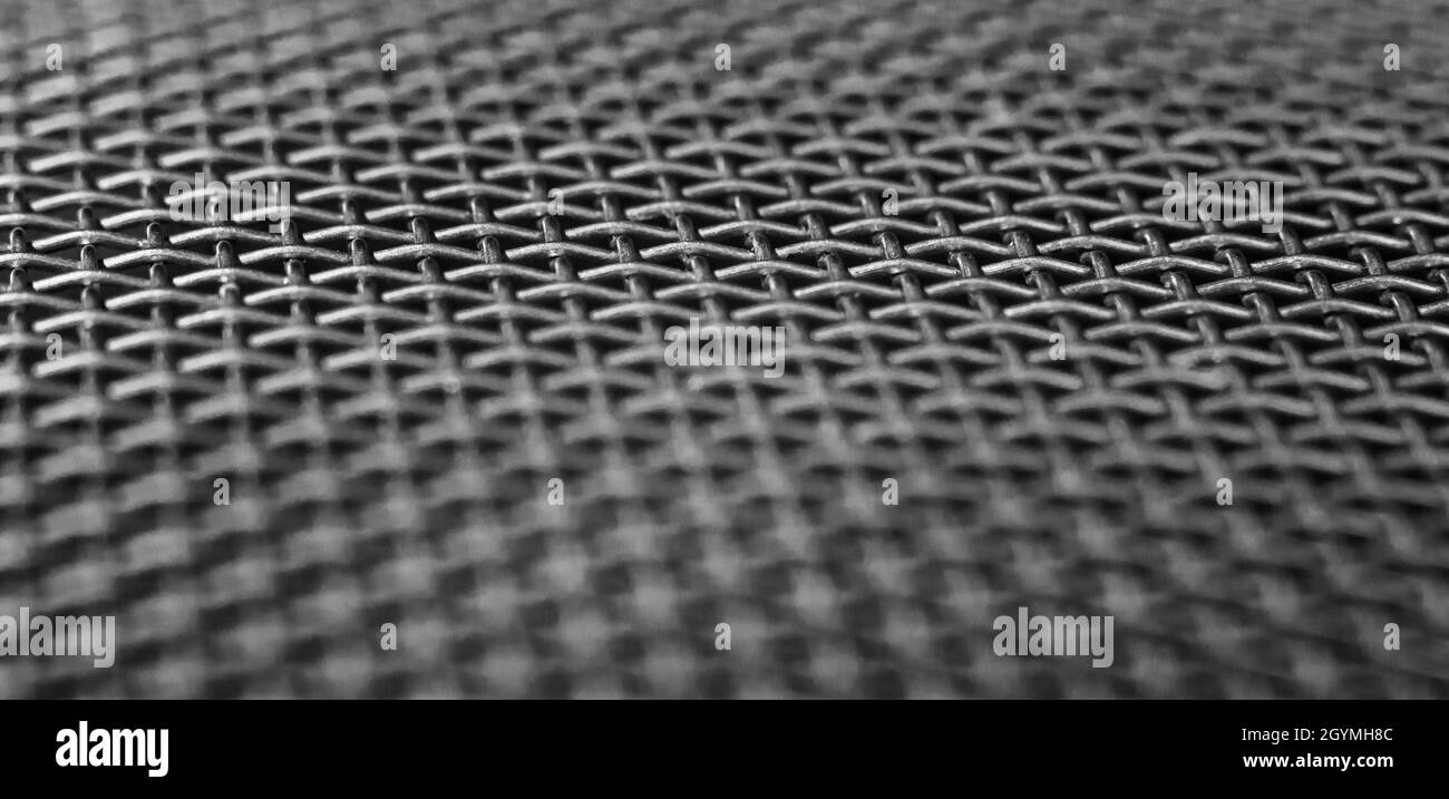 Macro Fotografia in bianco e nero di griglia in acciaio inox. Sfondo astratto Foto Stock