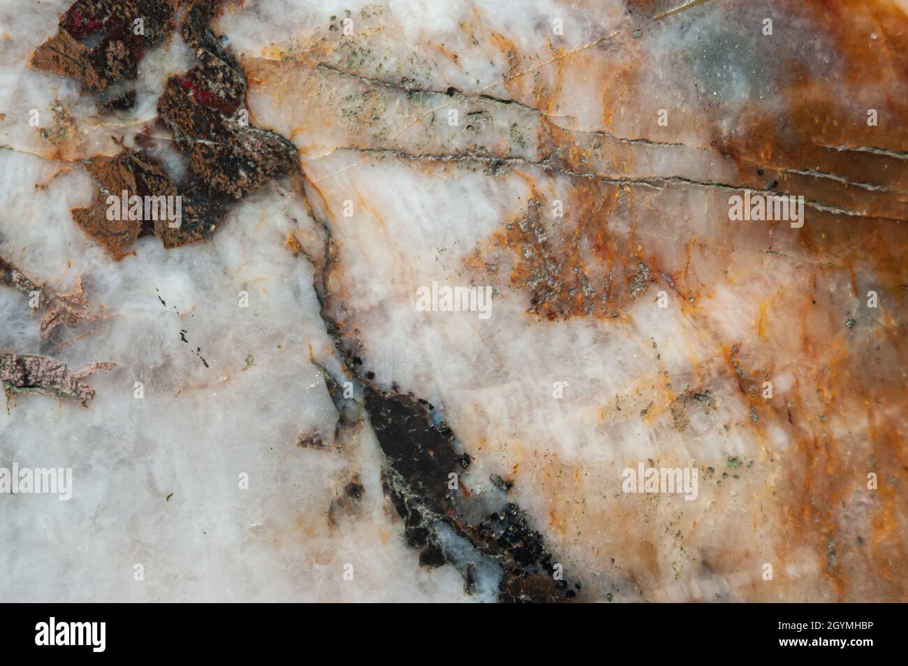 Pietra minerale di malachite lucidata testurizzata. Sfondo astratto. Foto Stock
