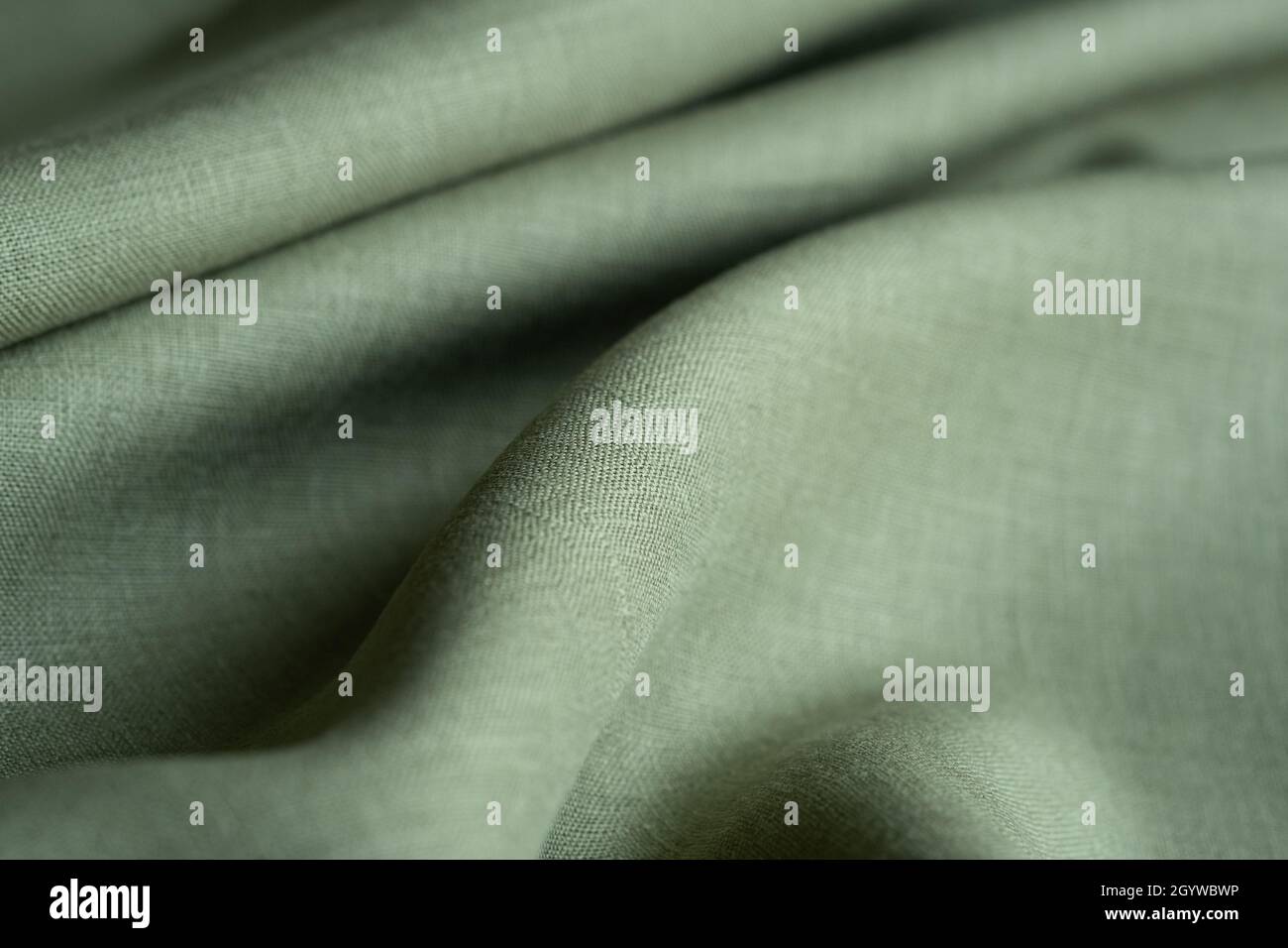 Tessuto di lino morbido. Sfondo in tessuto testurizzato. Macro con dof poco profondo Foto Stock