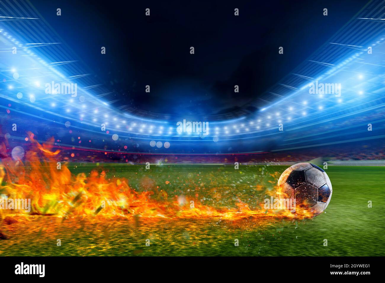 La palla di calcio in fiamma va veloce al campo stadio Foto Stock