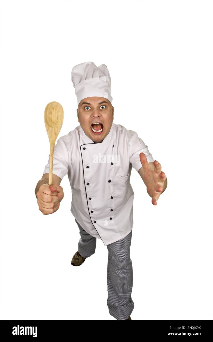 cuoco aggressivo con cucchiaio di legno Foto Stock