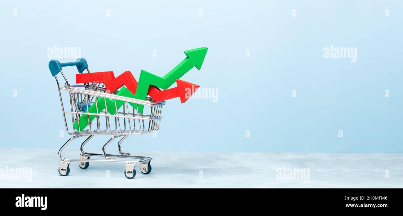 Carrello e frecce grafico crescita verde e rosso tuffo. Spazio di copia del modello per il testo. Foto Stock