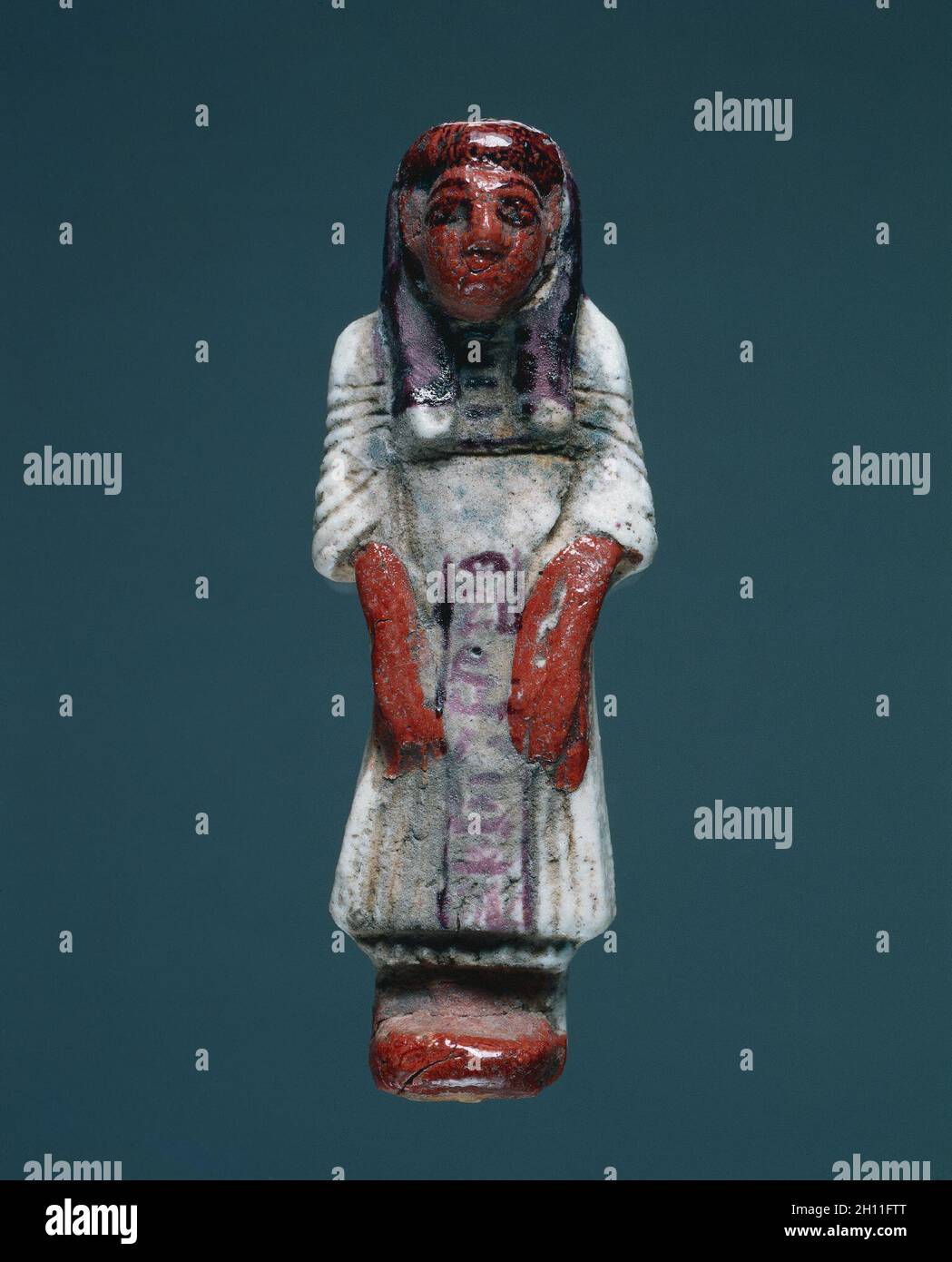 Shawabty in abito di vita quotidiana, 1295-1186 A.C. Egitto, Nuovo Regno, Dynasty 19. Maioliche policrome; complessivo: 13,5 x 5 x 3,2 cm (5 5/16 x 1 15/16 x 1 1/4 in.). Foto Stock