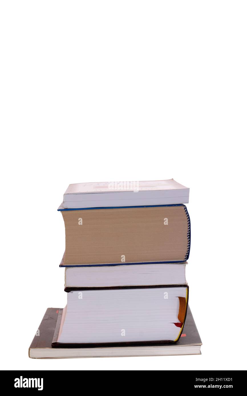 Pila di grandi libri uno sopra l'altro, isolato su sfondo bianco.. Pila di vecchi libri isolato su bianco Foto Stock